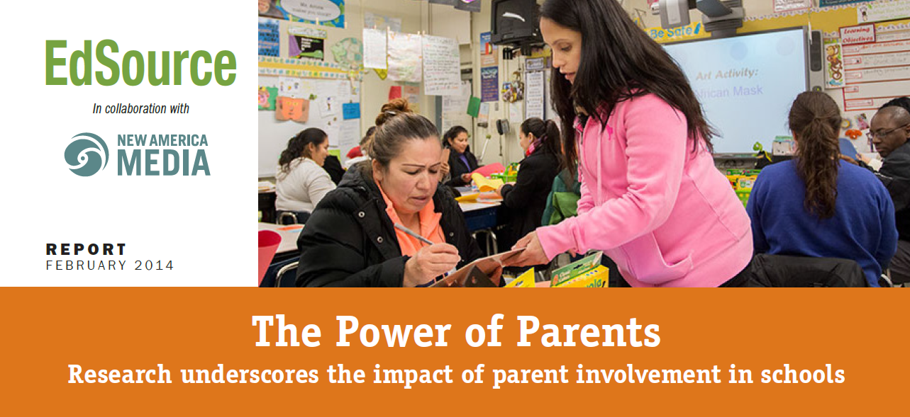 One woman helping another in a classroom. Picture says the power of parents. Research underscores the impact of parent involvement in schools.
